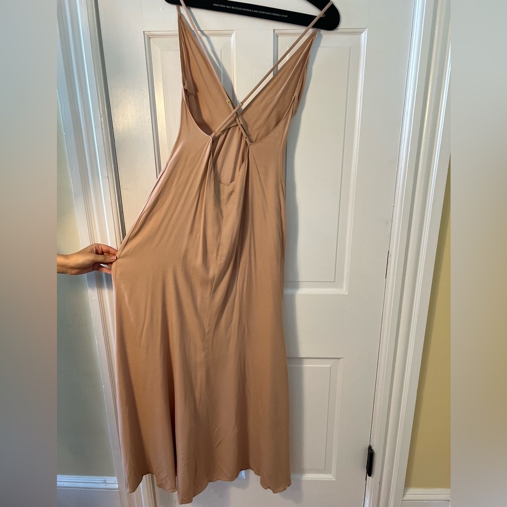 The reformation beige backless dress with slit